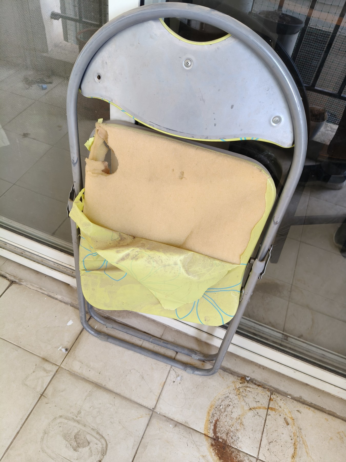 Broken/torn chair upholstery or back material